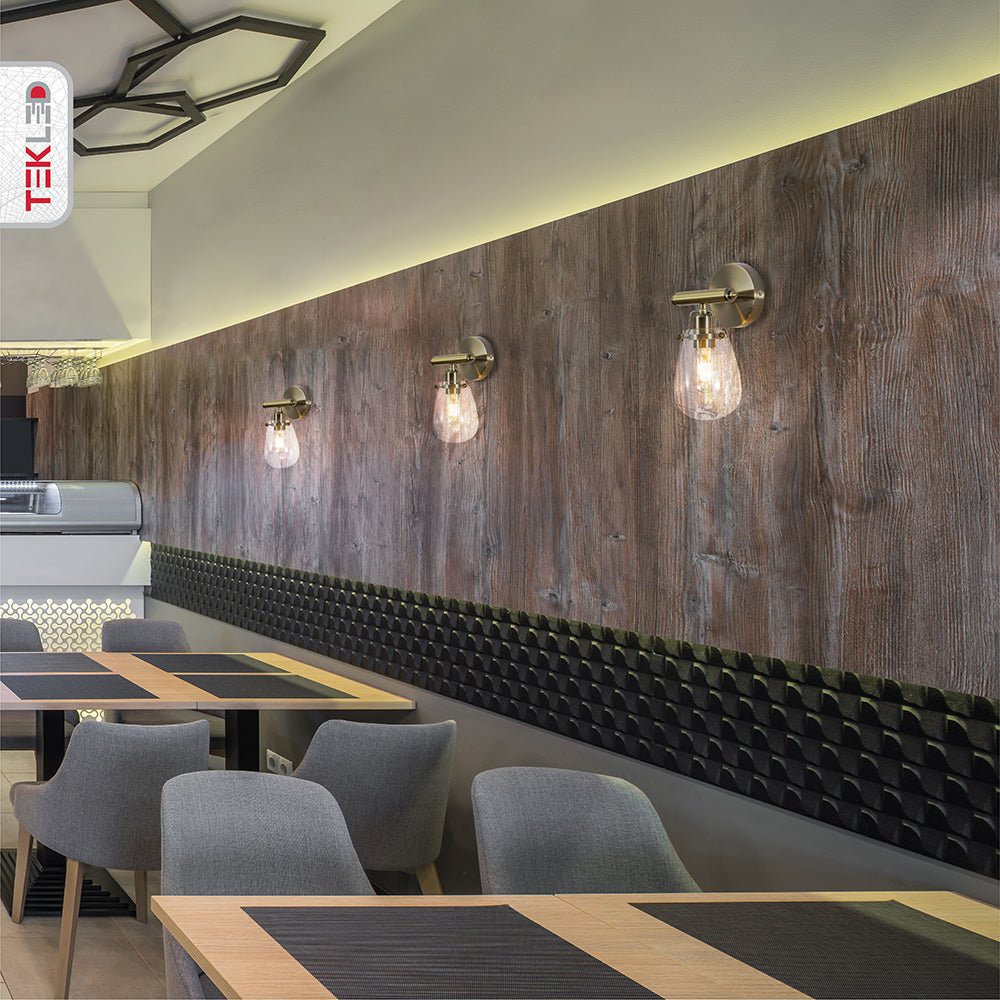 Indoor setting of Antique Brass Body Clear Glass Globe Wall Light with E27 Fitting