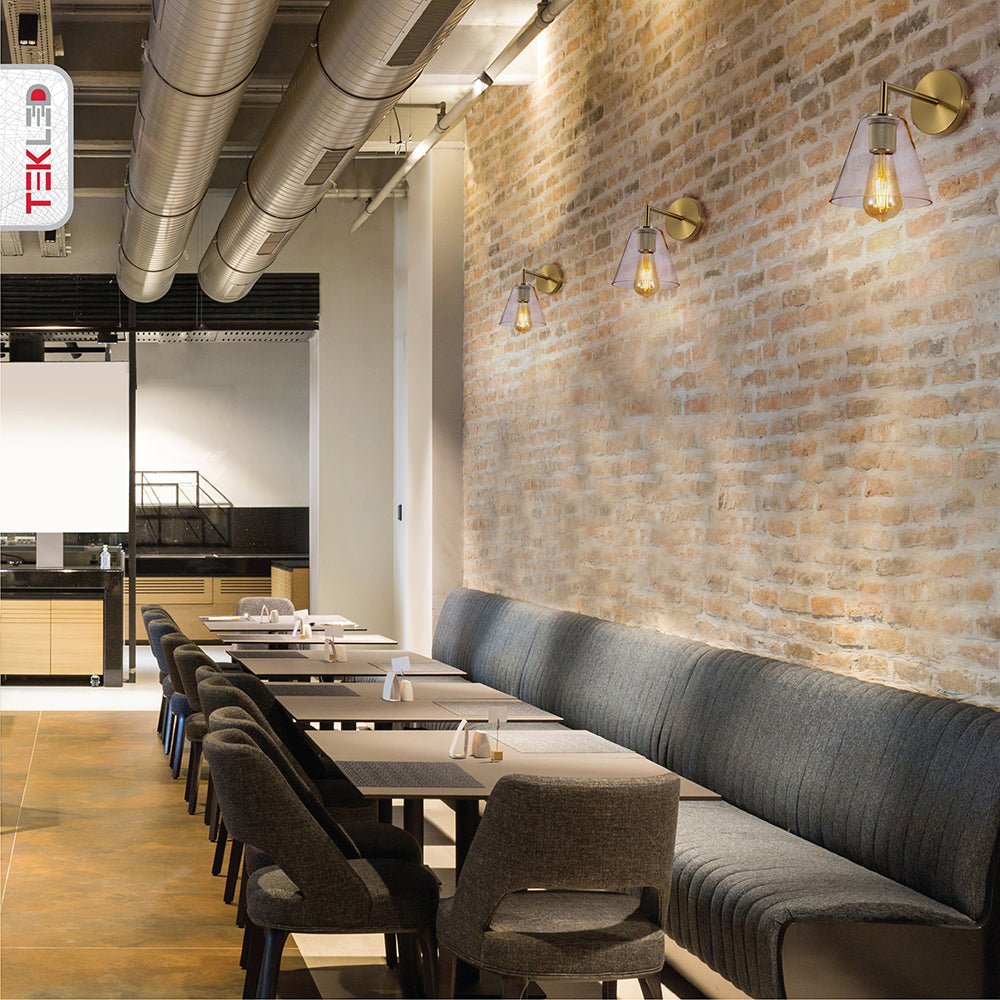 Indoor setting of Gold Aluminium Bronze Body Clear Glass Funnel Wall Light with E27 Fitting