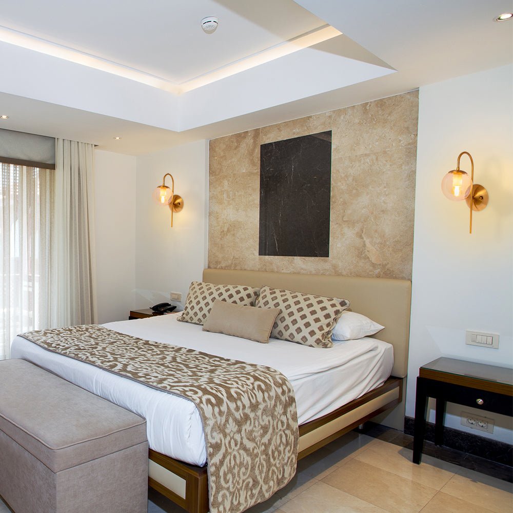 Interior application of Amber Globe Glass Gold Aluminium Bronze Cane Metal Downward Wall Light with E27 Fitting | TEKLED 151-19488