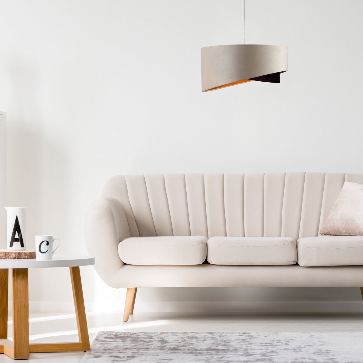 Beige coffee fabric cylinder pendant light with e27 fitting in indoor setting living room