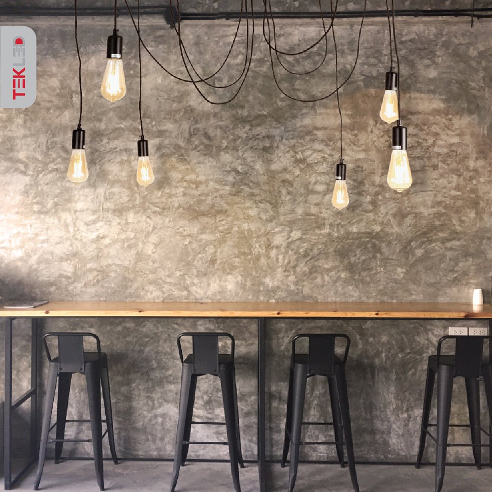 Black cord spider chandelier with 6xe27 fitting in indoor setting cafe