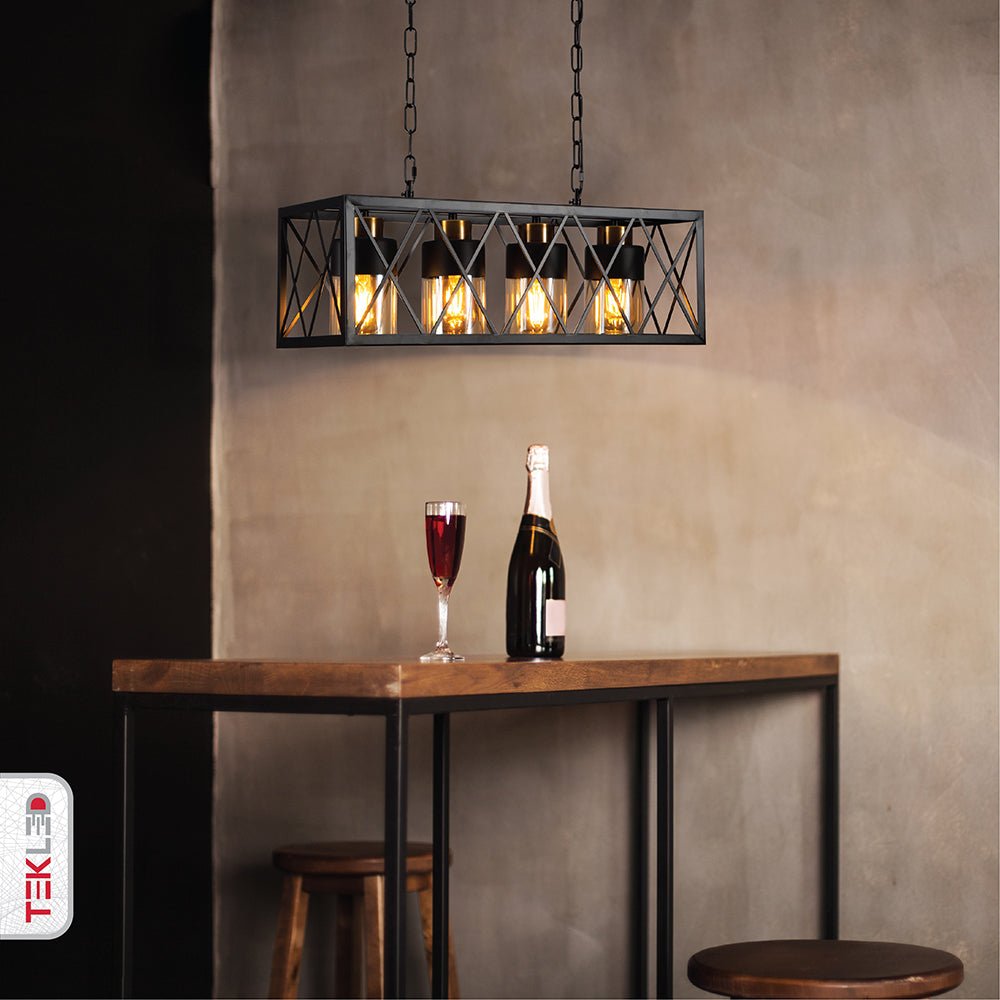 Black cuboid metal amber cylinder glass island chandelier with 4xe27 fitting in indoor setting kitchen