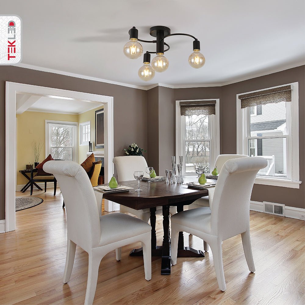 Black metal ceiling light with 4xe27 fitting in indoor setting living room