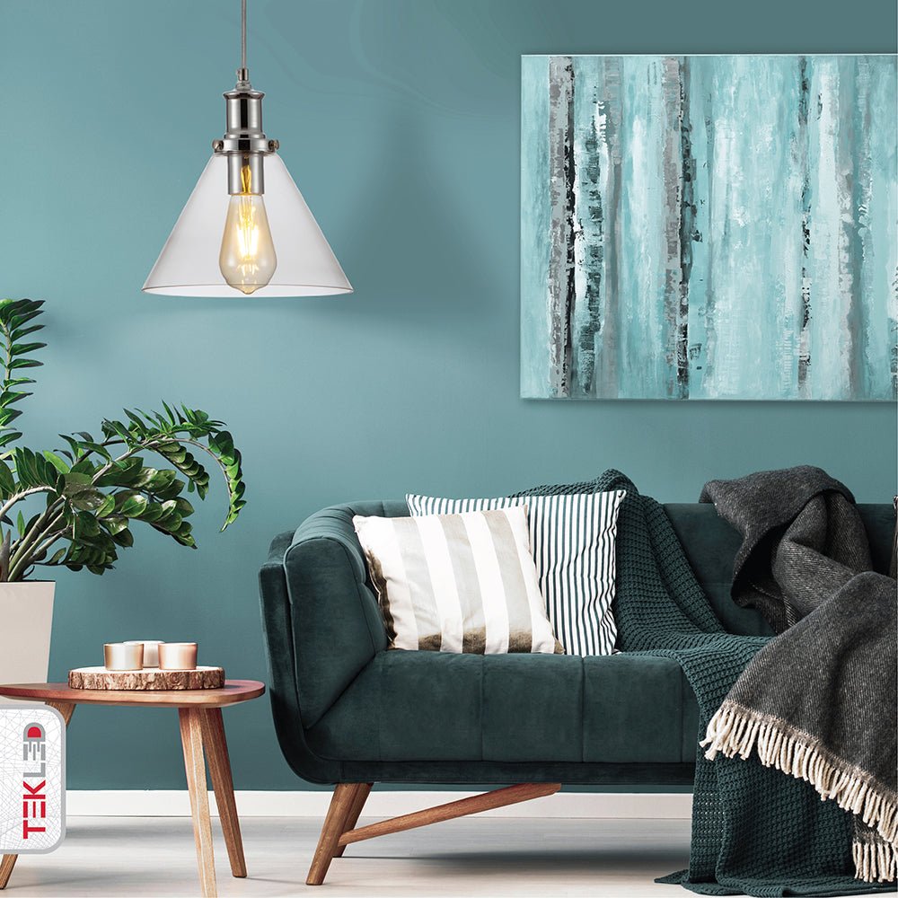 Chrome metal clear glass funnel pendant light with e27 fitting in indoor setting living room