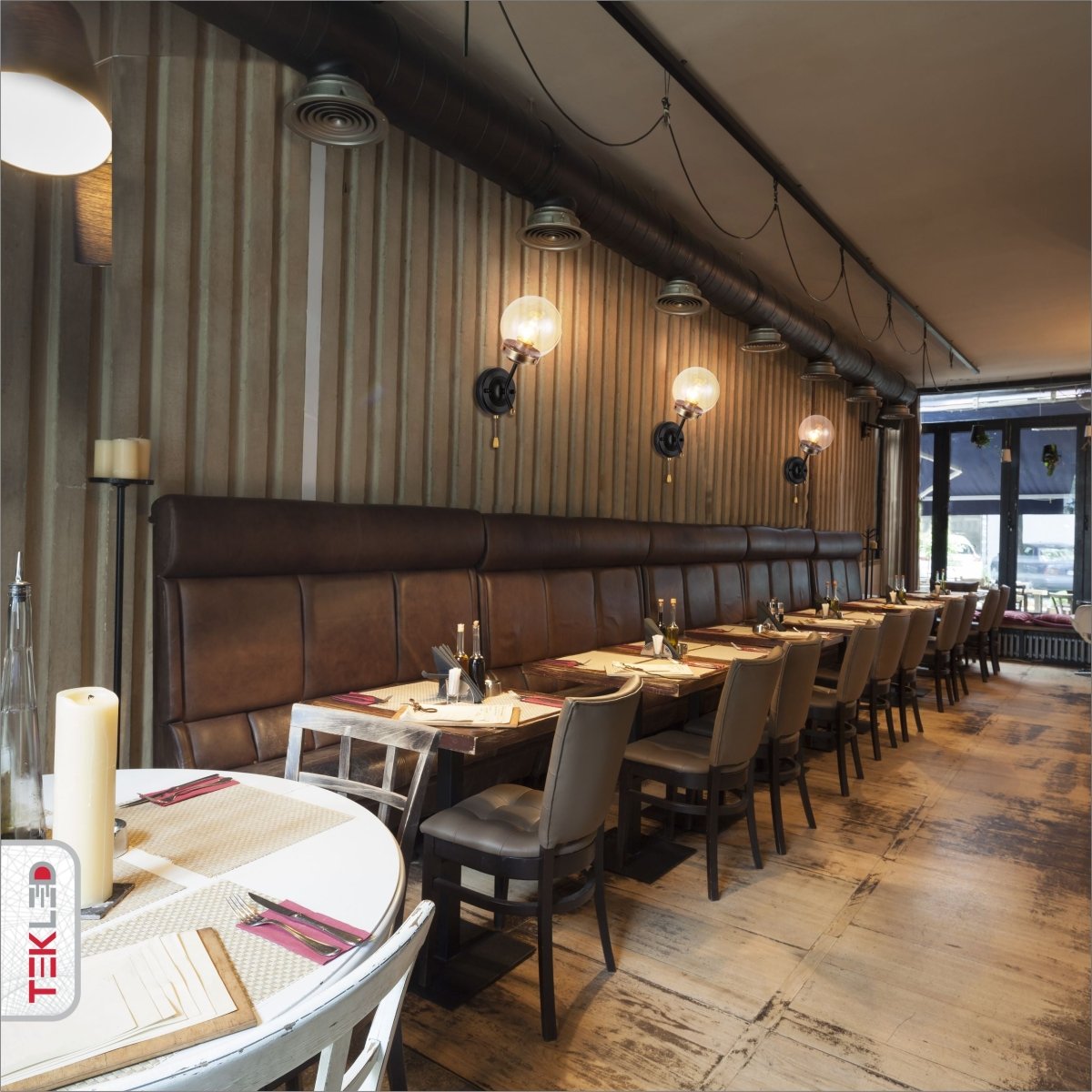 Amber Glass Antique Brass And Black Globe Wall Light E27 And Pull Down Switch in indoor setting cafe restaurant