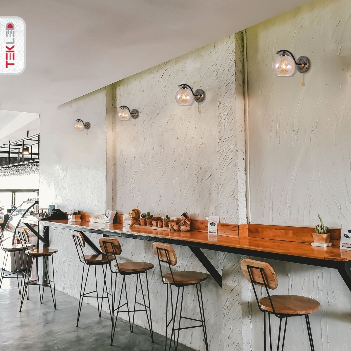 Amber Glass Black And Antique Brass Wall Light E27 And Pull Down Switch in indoor setting cafe