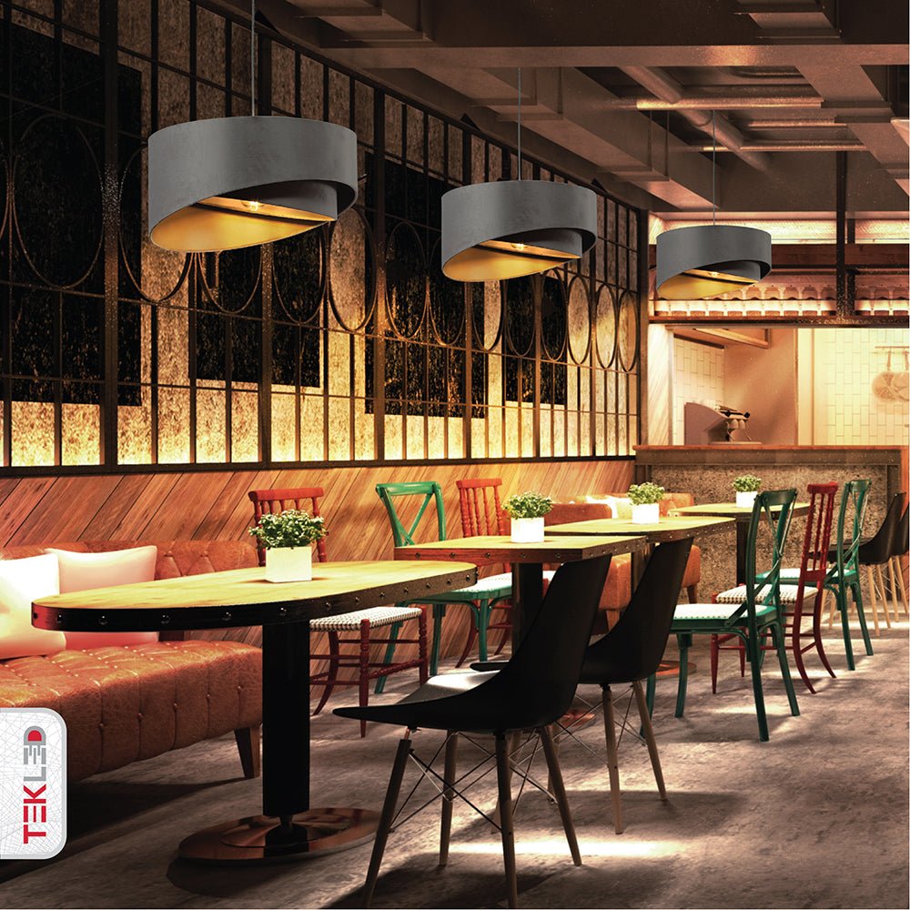 Grey fabric cylinder pendant light with e27 fitting in indoor setting cafe restaurant
